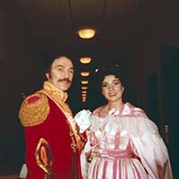 Harlan standing with partner in opera, Fort Worth